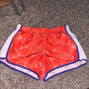 Orange and purple athletic shorts